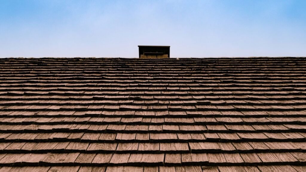 a house roof and blue sky