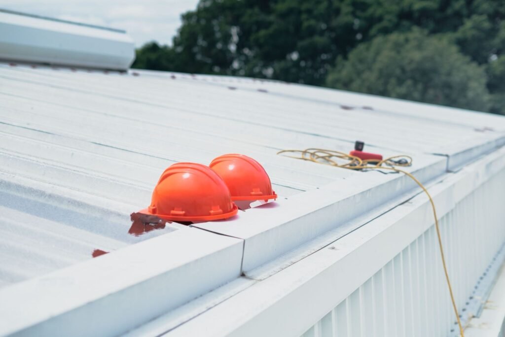 Work helmets on a metal roof